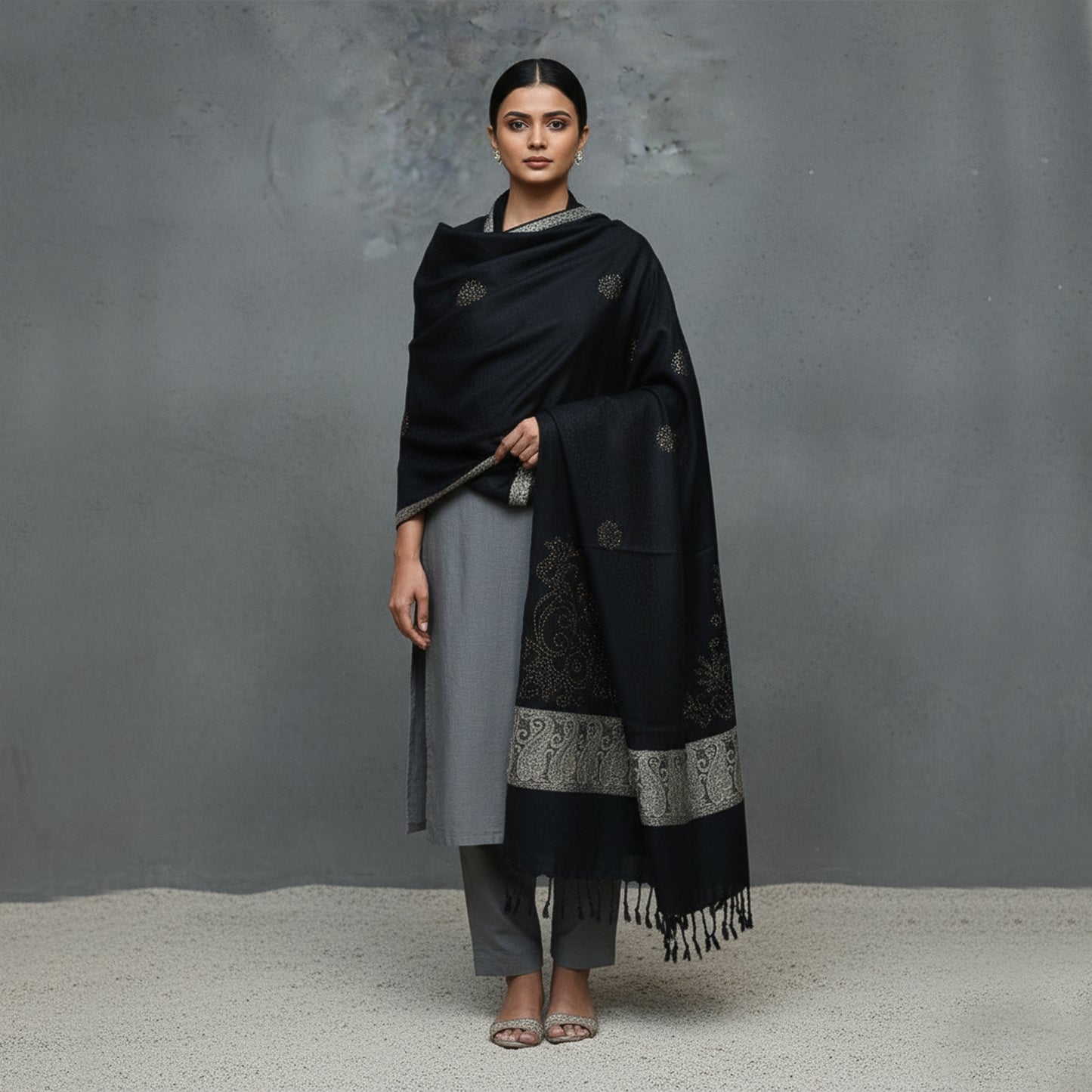 Woman wearing a black and gray patterned Shawl 