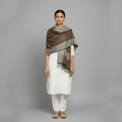 Woman wearing a brown and gray patterned Shawl  