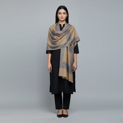 Woman wearing a beige and brown patterned Embroidered Shawl 